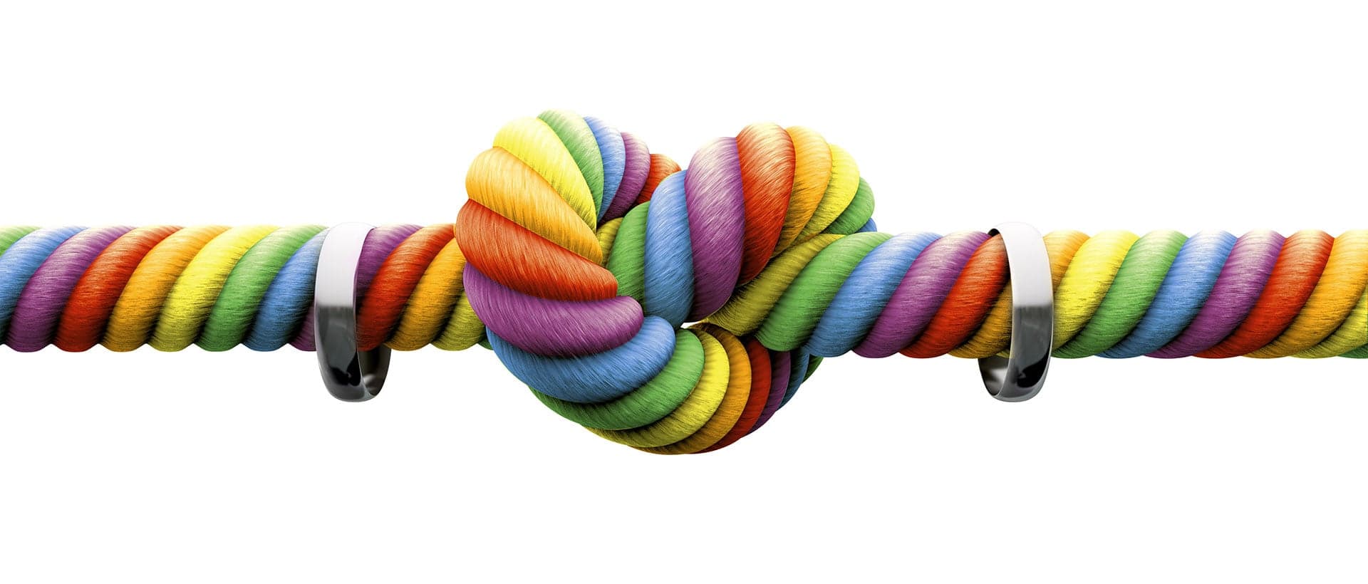 Rainbow rope tied in a heart with wedding rings